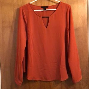 Rust colored long sleeve sheer blouse